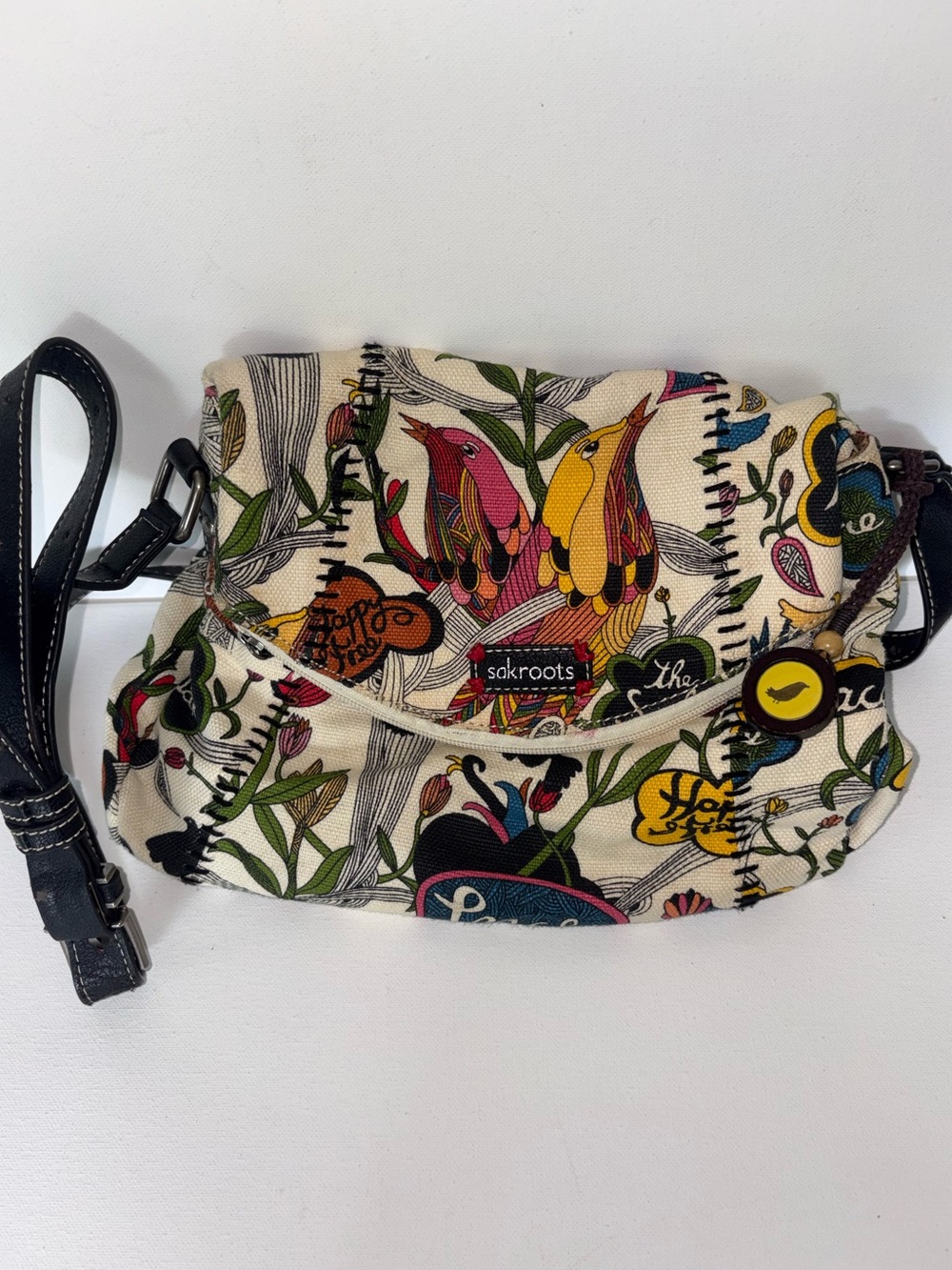 Sakroots Peace Crossbody Bag in Cream with Multicolor Print